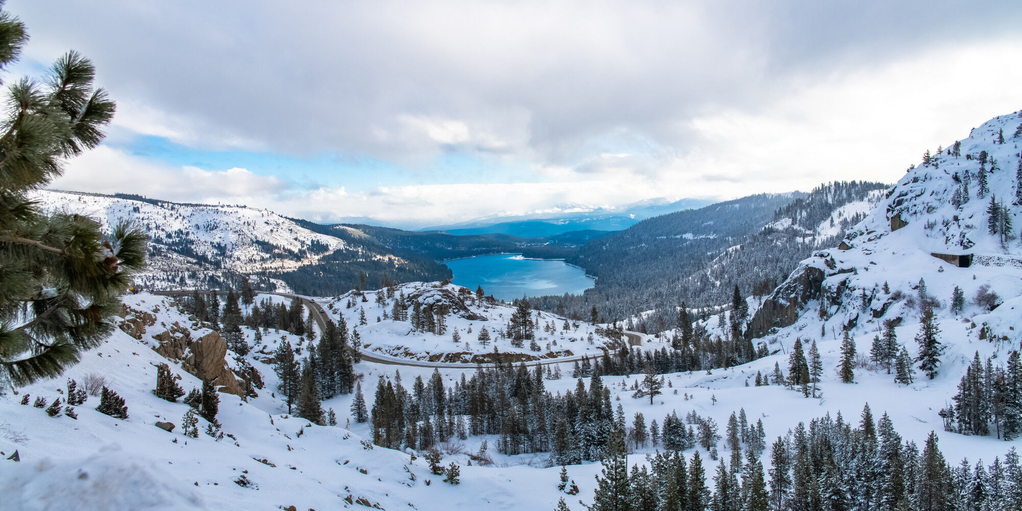 snow-capped mountain with a lake in the background
				        