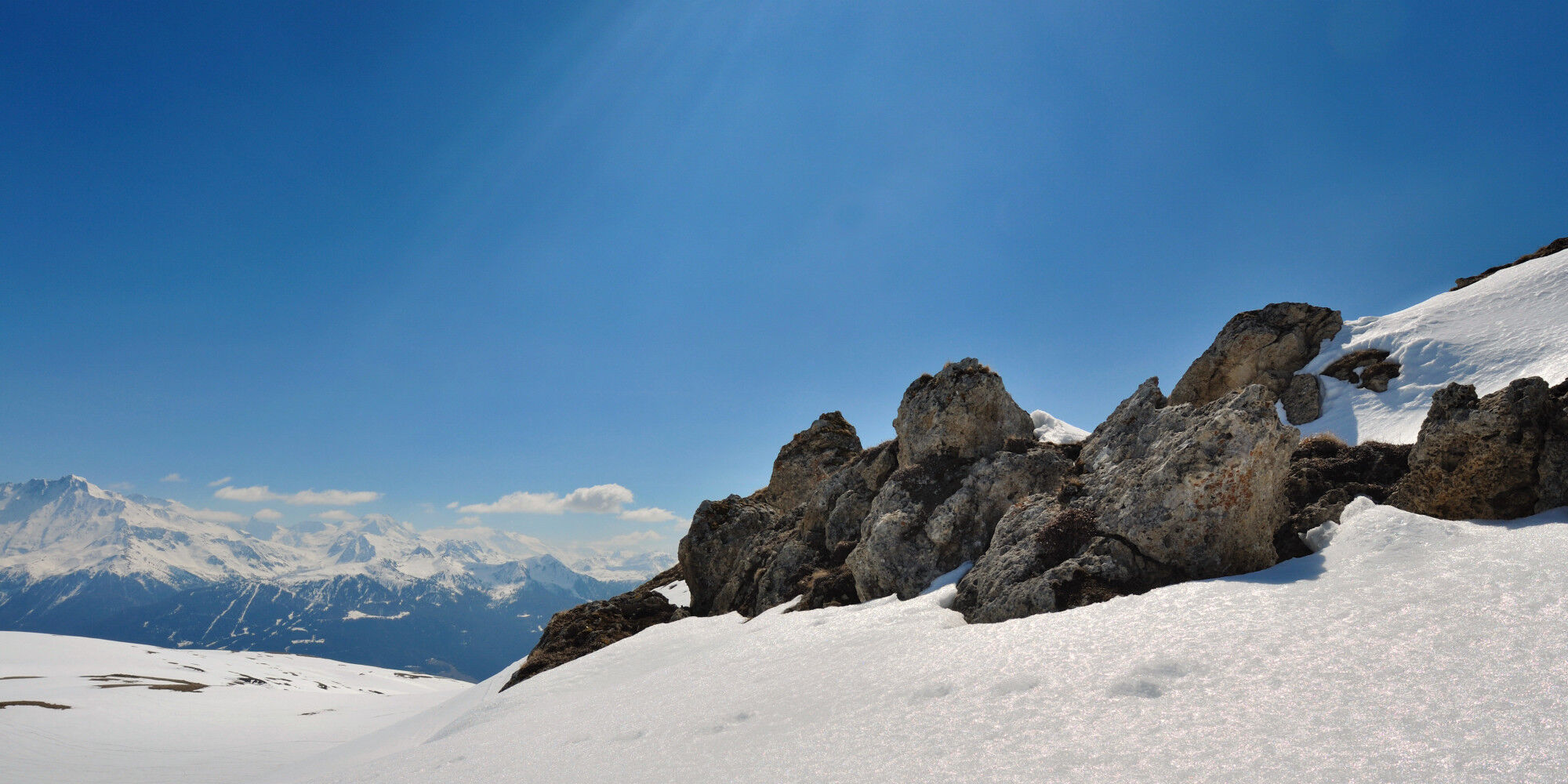 rocky mountain snow and blue sky
				        