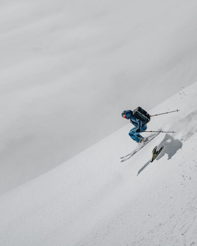 freerider hurtling down a slope with an airbag