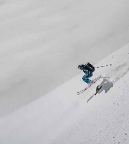 freerider hurtling down a slope with an airbag
		                        