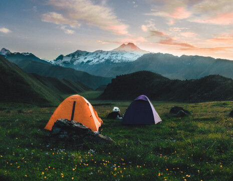 tents in the mountains camping and bivouacking
					        