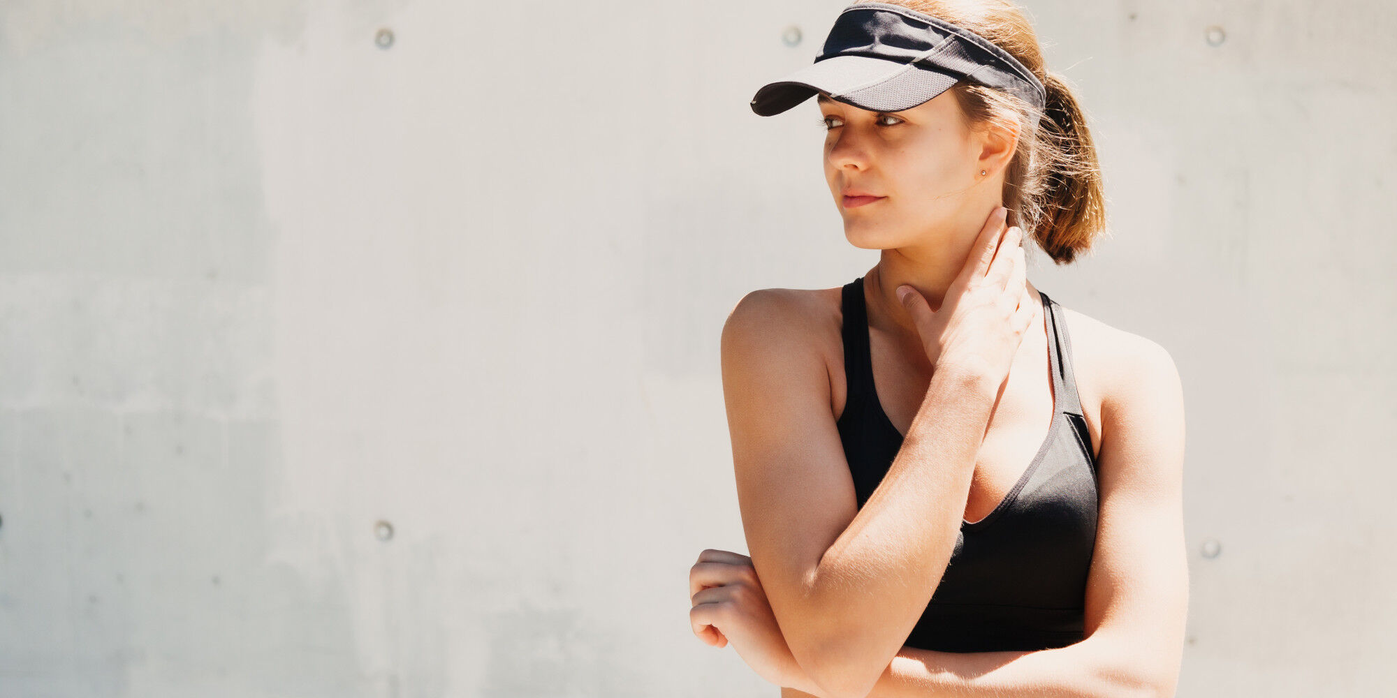 sporty woman in headgear
				        