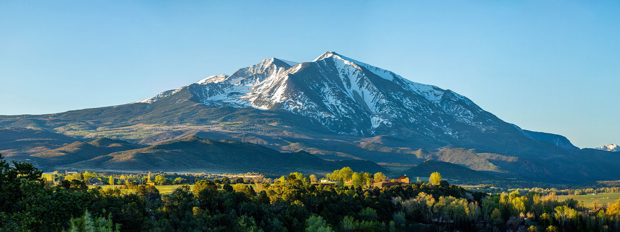 Summer mountains and snow-capped peaks