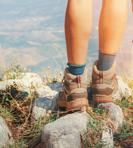 Person wearing hiking boots
		                        