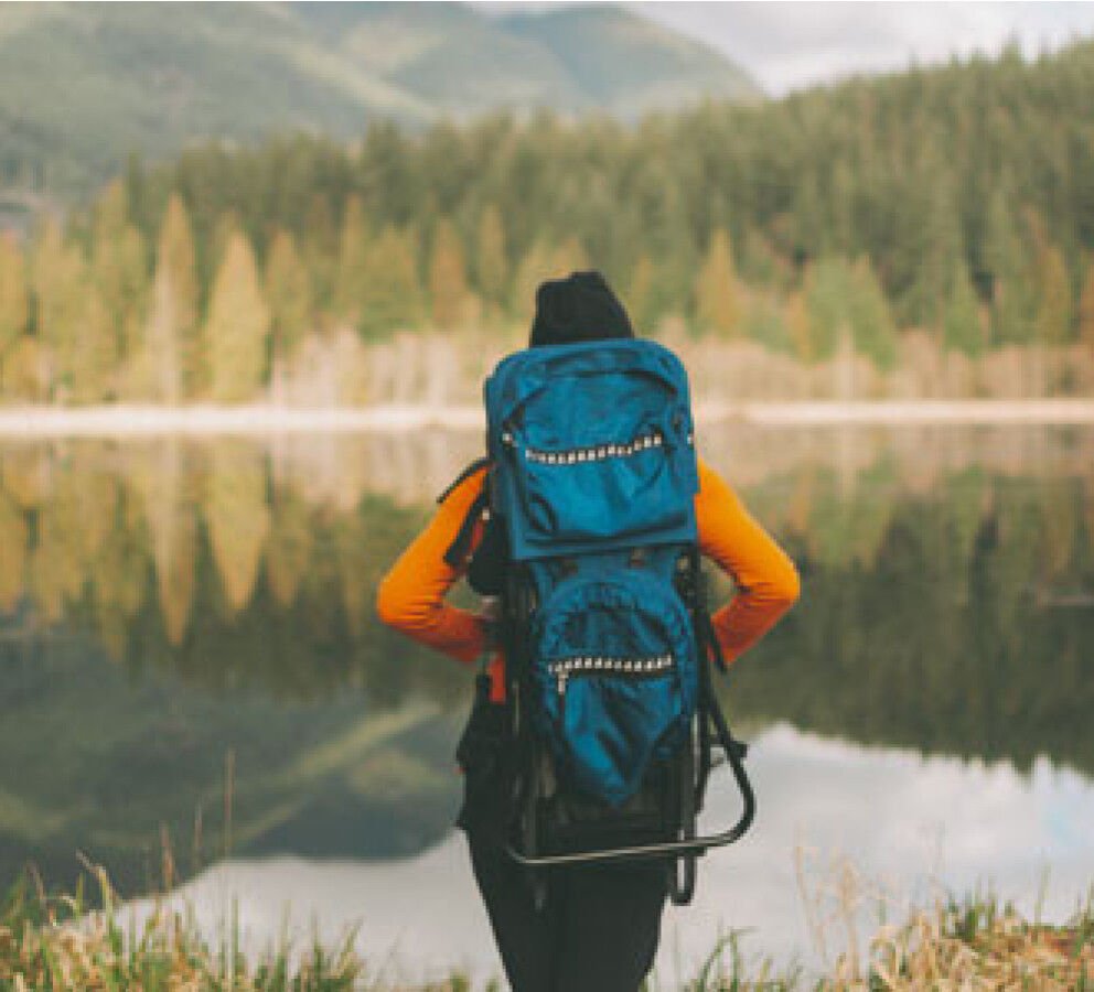 Woman hiking with baby carrier