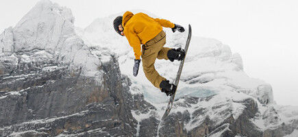 freestyle snowboarder in the mountains