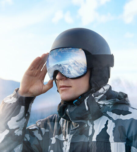 skier with ski helmet and ski goggle
		                        